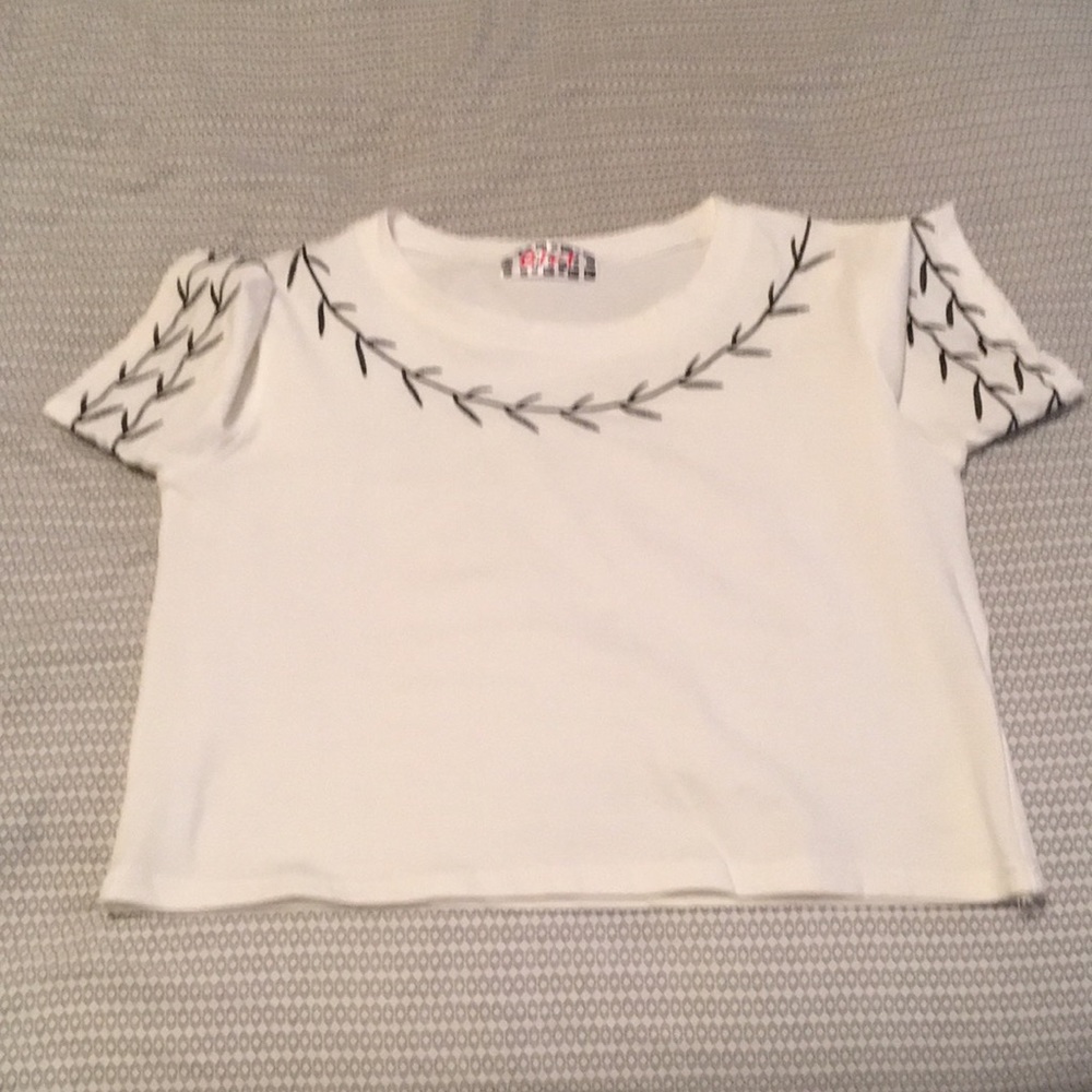 Embroidered small white mid-drift shirt.